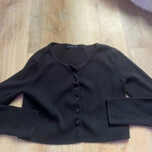 This is an adorable brandy melvile sweater. Semi cropped. Very good material.